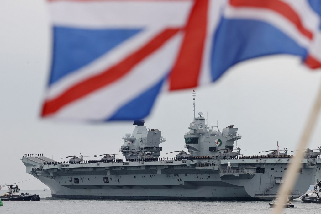 Britain's HMS Queen Elizabeth aircraft carrier at Portsmouth Naval Base, on England's south coast, 1 May 2021 (Adrian Dennis/AFP)