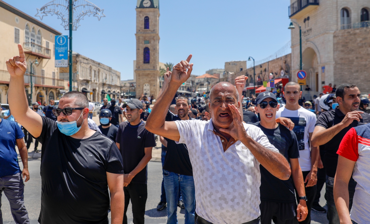 Palestinian citizens of Israel demonstrate on 12 June in the Old City of Jaffa against the decision by the Tel Aviv municipality to demolish the al-Isaaf cemetery (AFP)