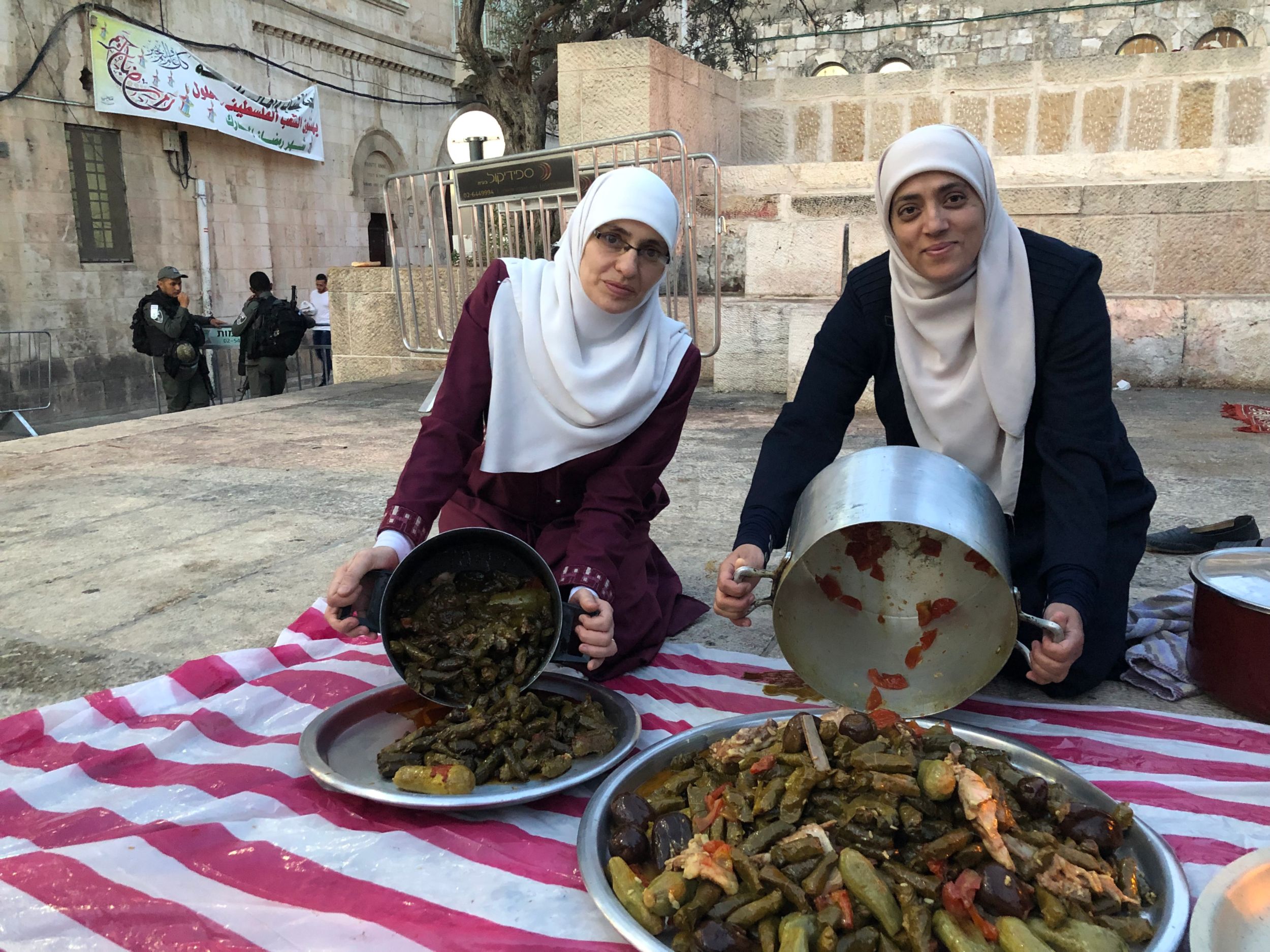 Halawani, left, and Khweiss organised iftars outside of Al-Aqsa during the Muslim holy month of Ramadan (MEE/Juman Abu Arafeh)