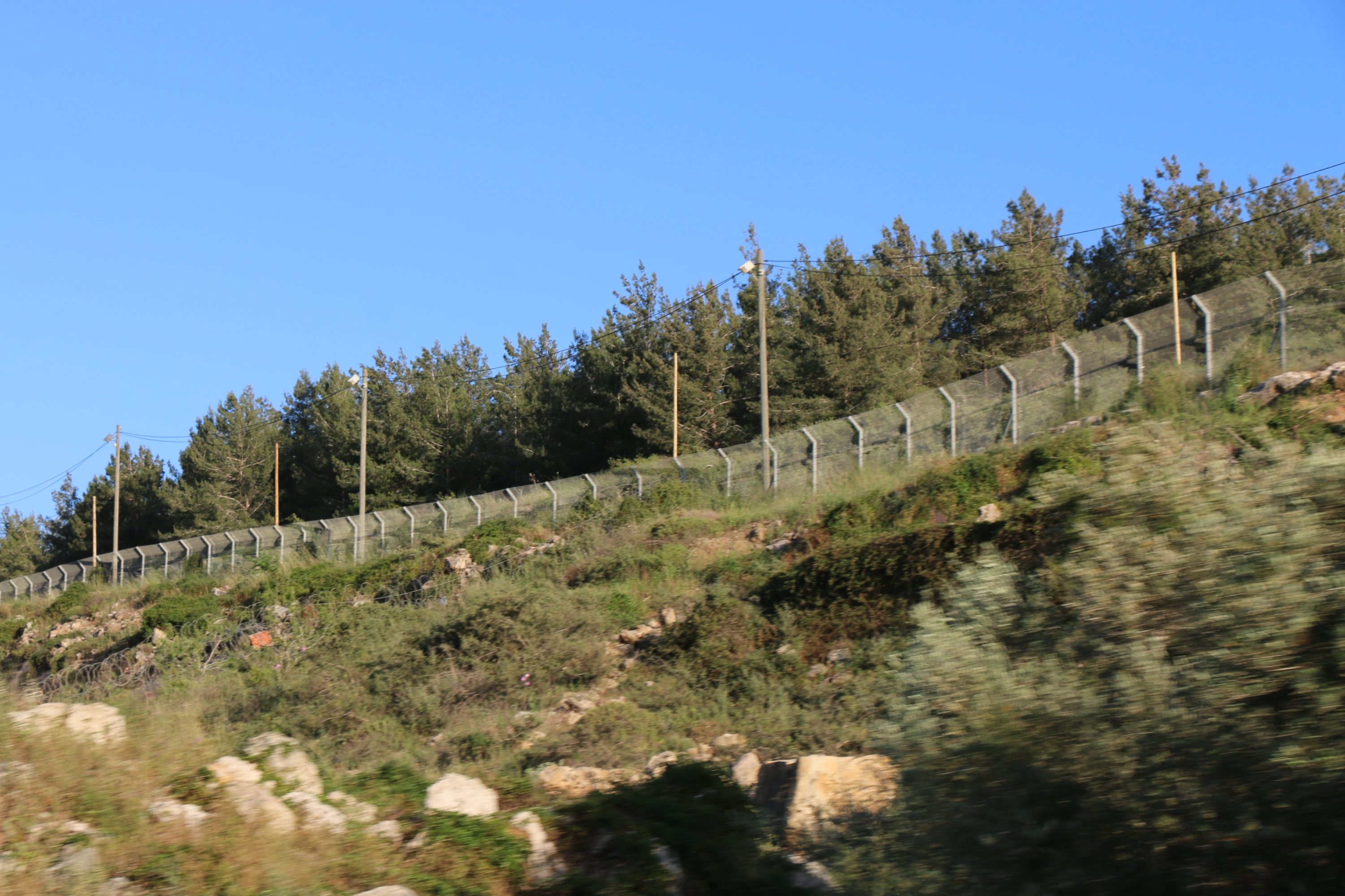 An Israeli fence runs through the Yousif family's land near the illegal Israeli settlement of Ariel (MEE/Akram al-Waara)