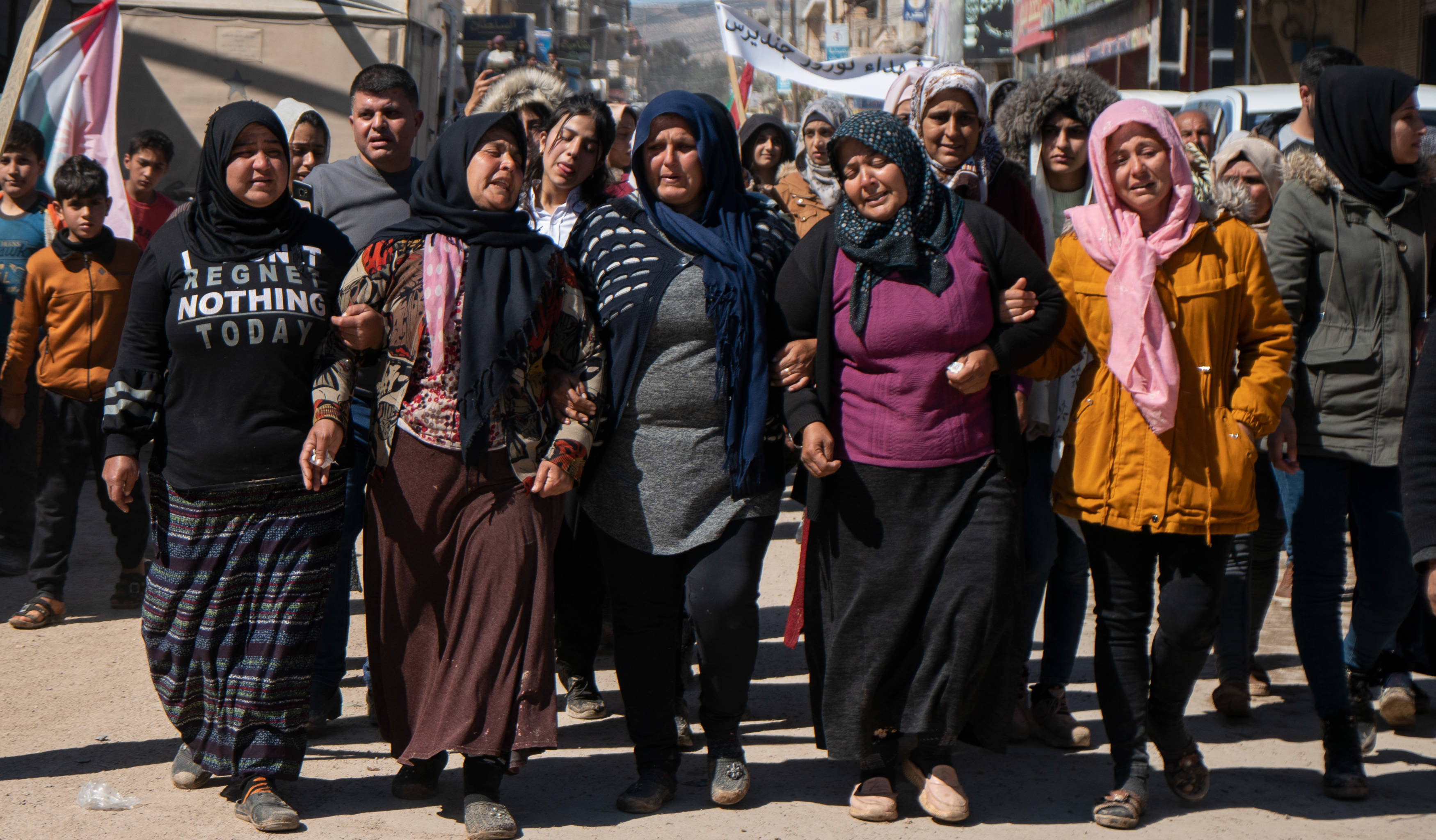 Women mourn four civilian Kurds who were killed by pro-Turkish fighters in Jindayris, Syria, 21 March 2023 (MEE/Ahmad Fallaha)