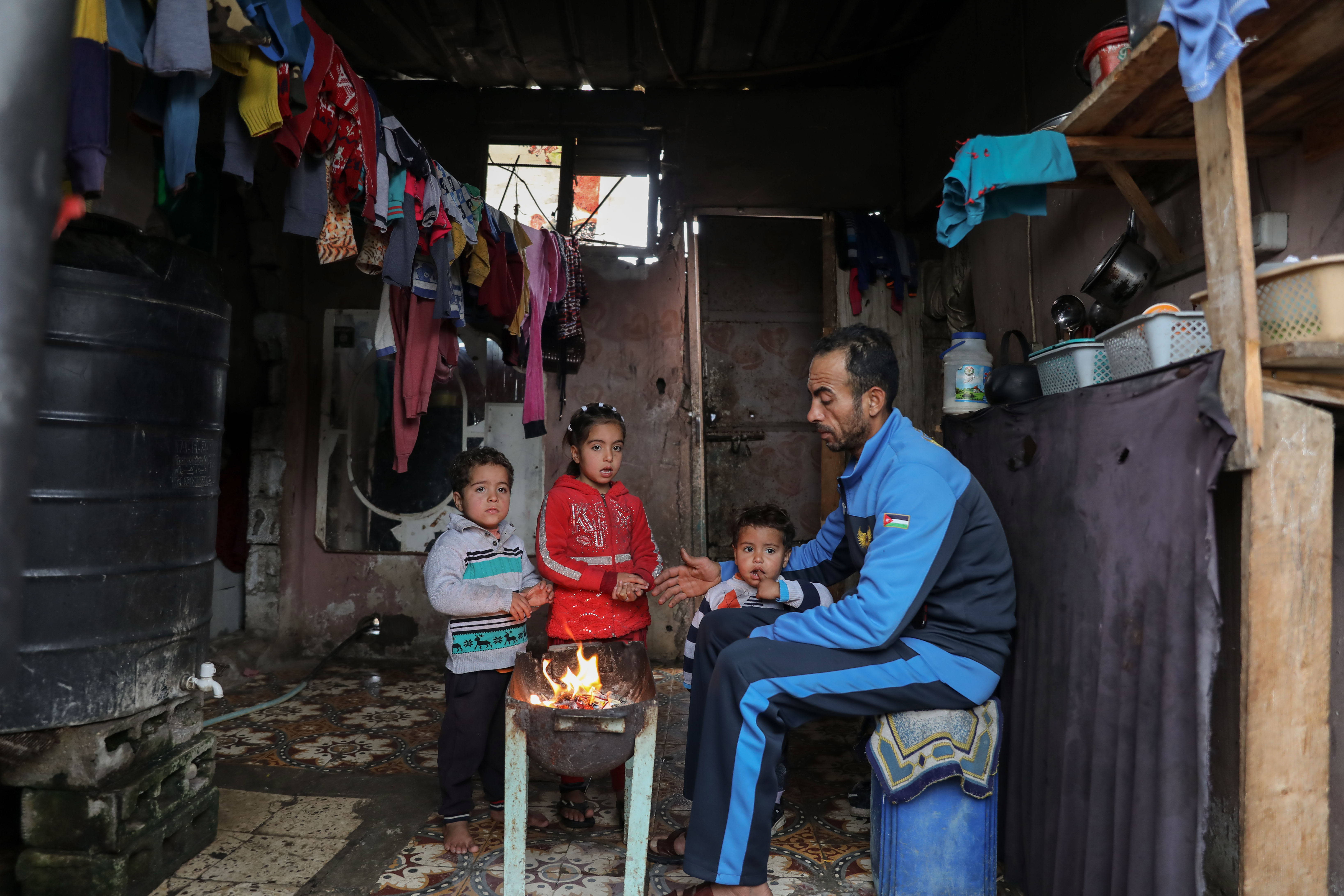 Man with his children in Gaza