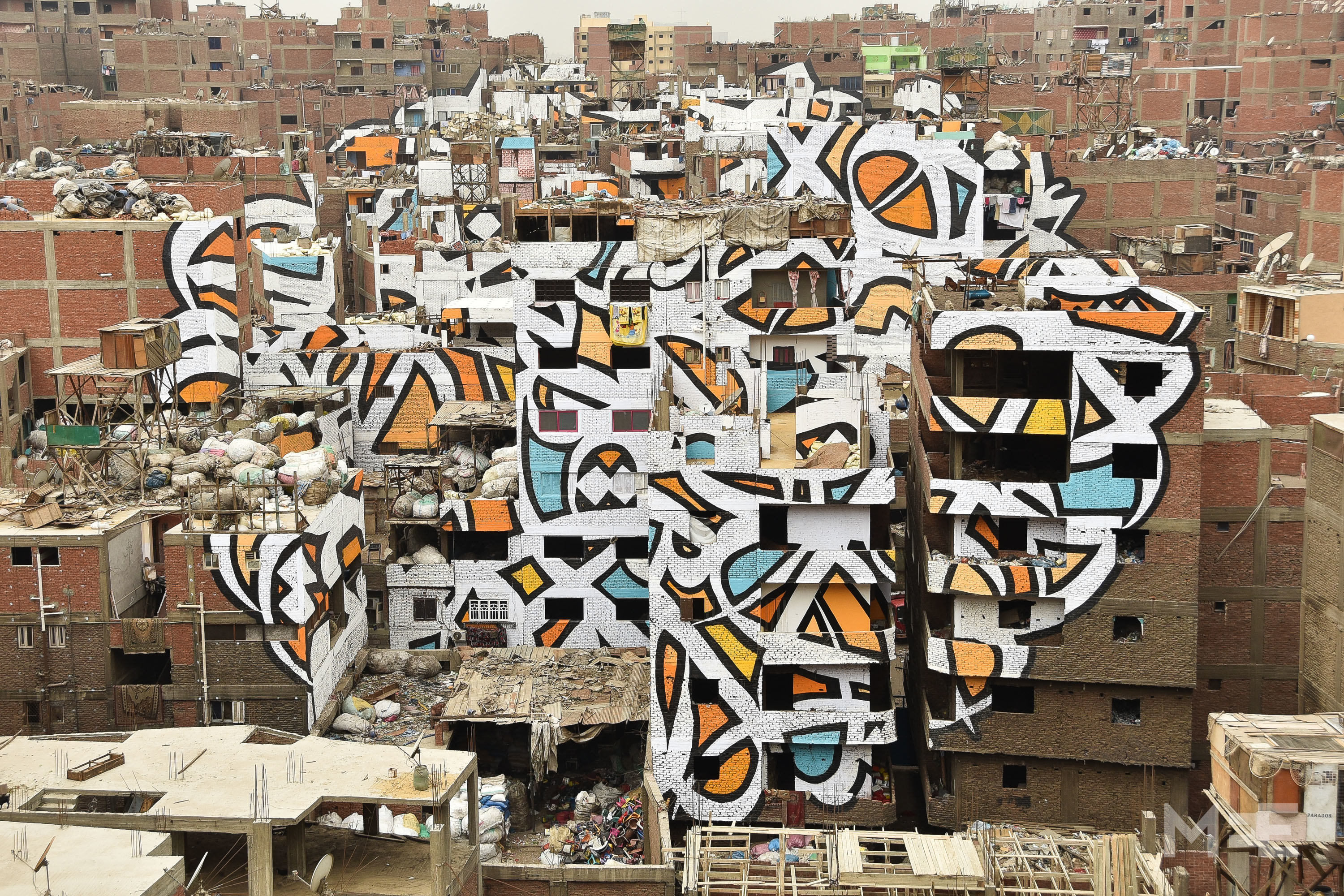 Giant mural brings sunlight to Cairo's garbage district | Middle East Eye
