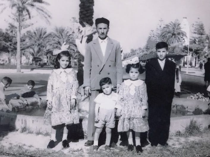 Najlaa Elagelli's photo shows her family standing in front the Ghazala fountain in Tripoli