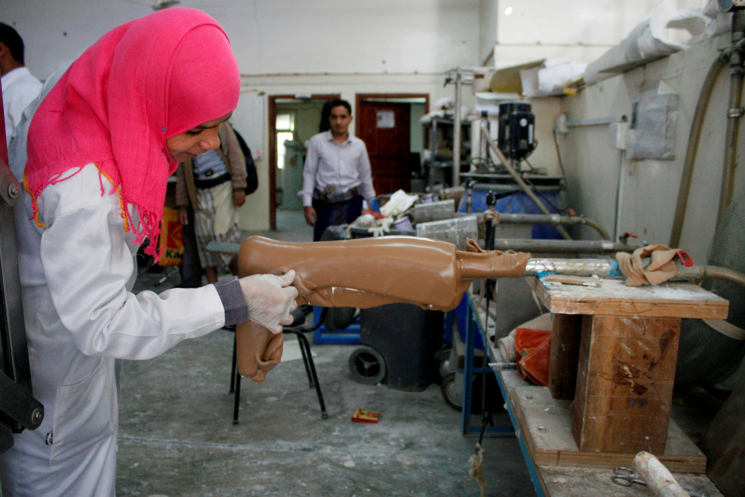A worker prepares an artificial leg at a prosthetic limbs centre in Taiz in 2017 (Reuters)