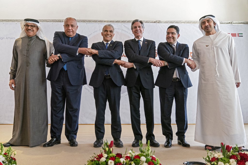 The foreign ministers of Bahrain, Egypt, Israel, the US, Morocco and the UAE pose for a photo after the Naqab Summit on 28 March 2022 (AFP)
