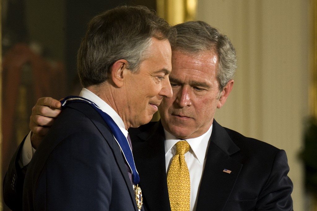 US President George W Bush (R) awards former British Prime Minister Tony Blair (L) the Presidential Medal of Freedom at the White House, Washington, DC, 13 January 2009