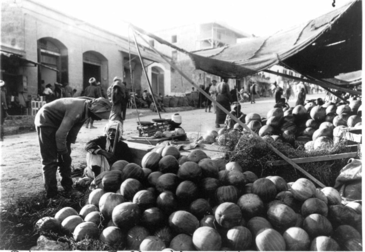 Palestinian farmers sell their watermelons at a Jaffa market in 1940 (Social media/Palestine agricultural memory Facebook page)