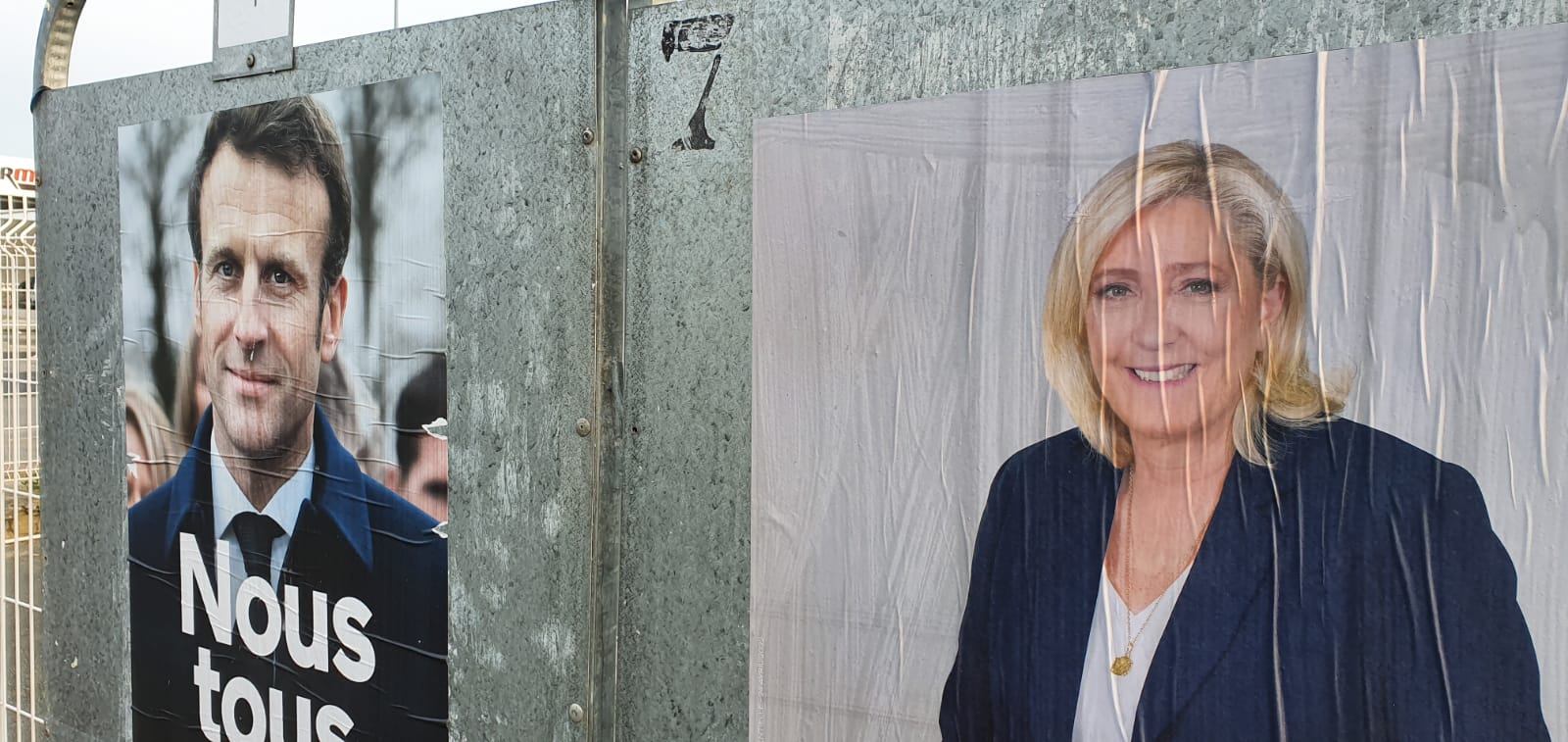 Campaign posters showing Macron and Le Pen in Calais (MEE/Frank Andrews)