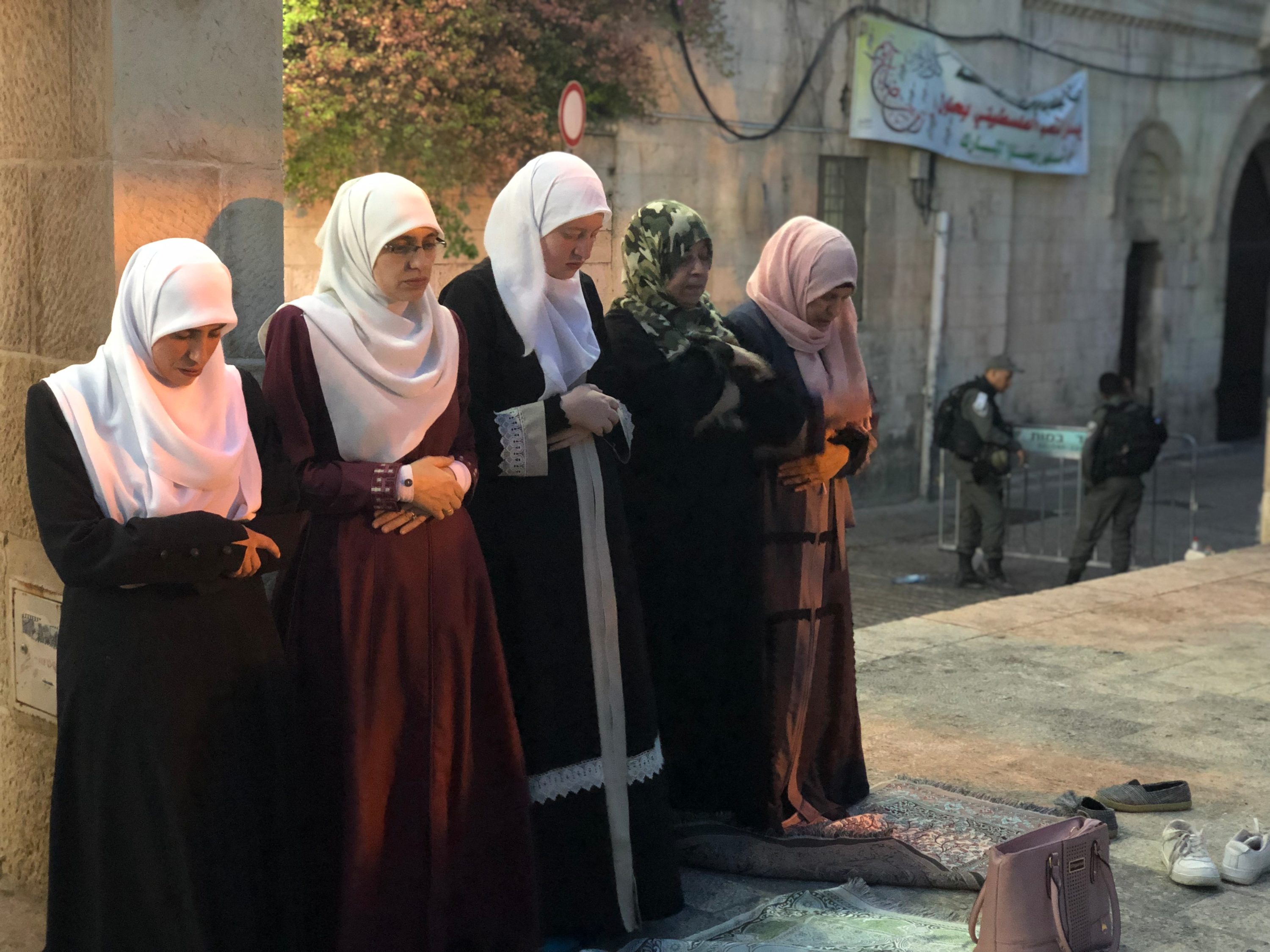 Women praying outside Al-Aqsa MEE Juman Abu Arafeh