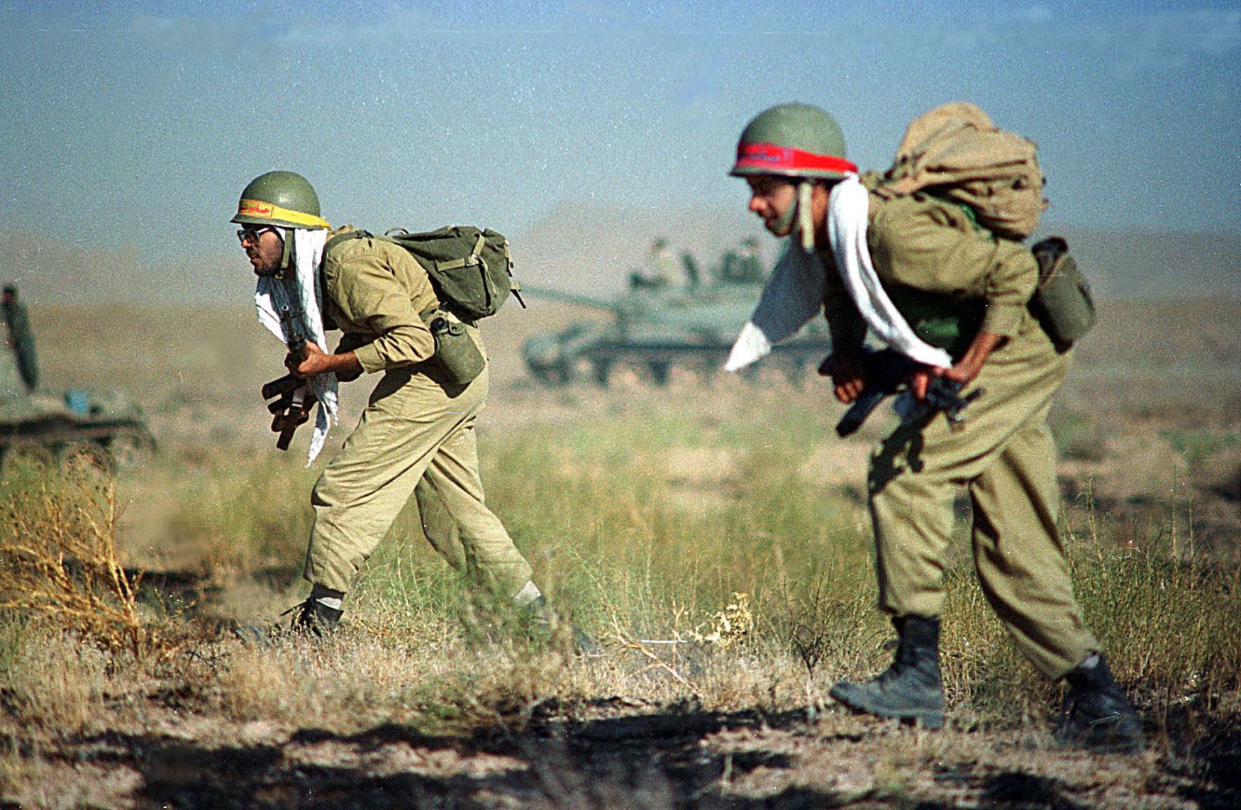 Iranian soldiers march forward during the largest-ever Revolutionary guards' exercises near the Afghan border 06 September 1998 (AFP)