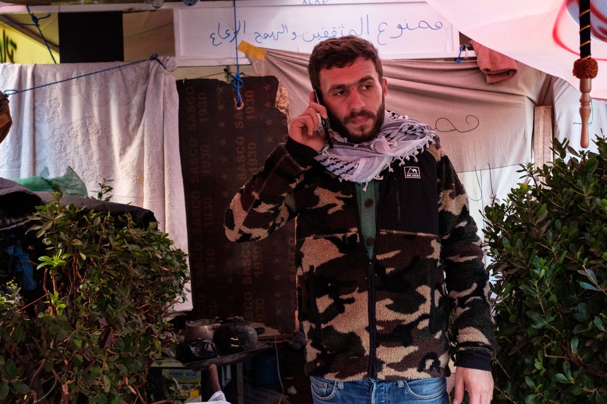 Ahmad Ghazzal, born to a Lebanese mother and Palestinian father, outside his tent which he shares with a friend in Riad al-Solh Square (MEE/Rita Kabalan)