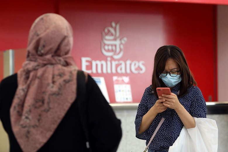 A traveller at Dubai International Airport after UAE officials confirmed the country's first case of coronavirus (Reuters)