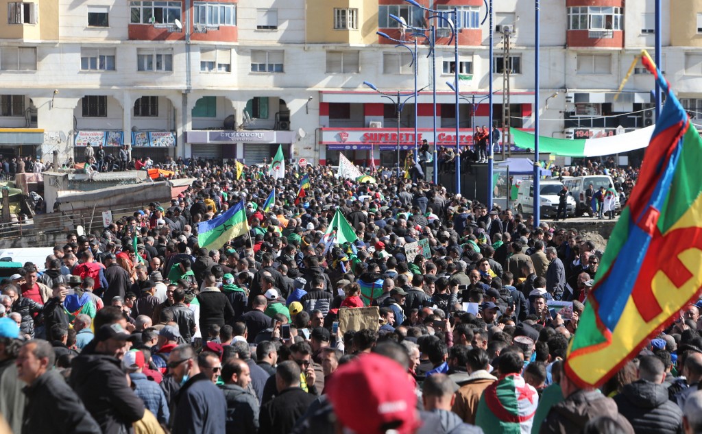 Algerians stage a protest in the northern town of Kherrata on 16 February 2021 (AFP)