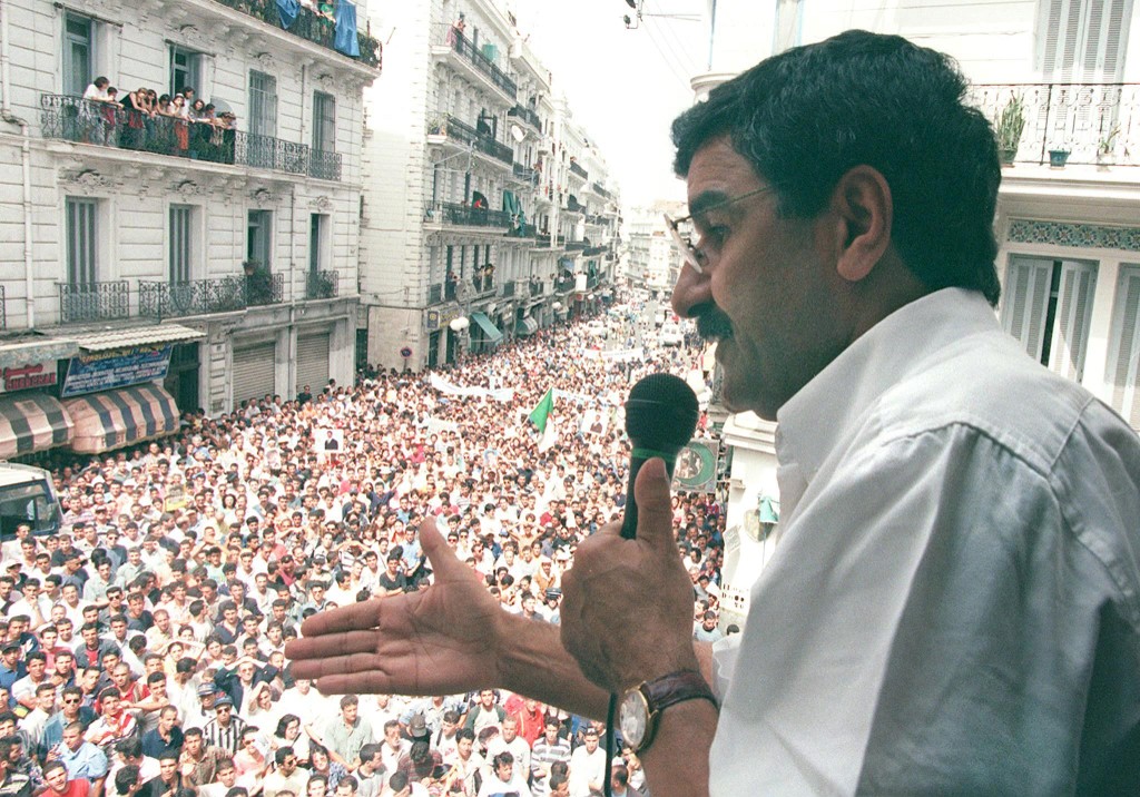 (Photo legend) The former leader of the RCD, Saïd Sadi, addressing the crowds in Algiers on 2 July 1998, at a protest against the new law establishing Arabic as the sole official language in Algeria (AFP)