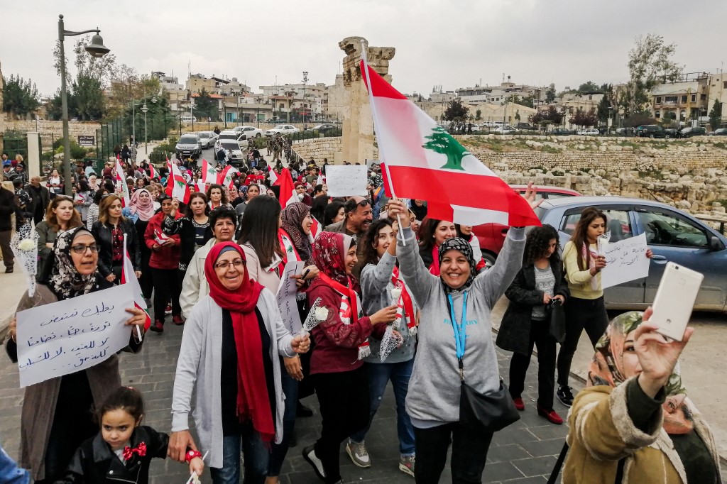 Lebanese people demonstrate in the Bekaa Valley city of Baalbek on 26 October (AFP)