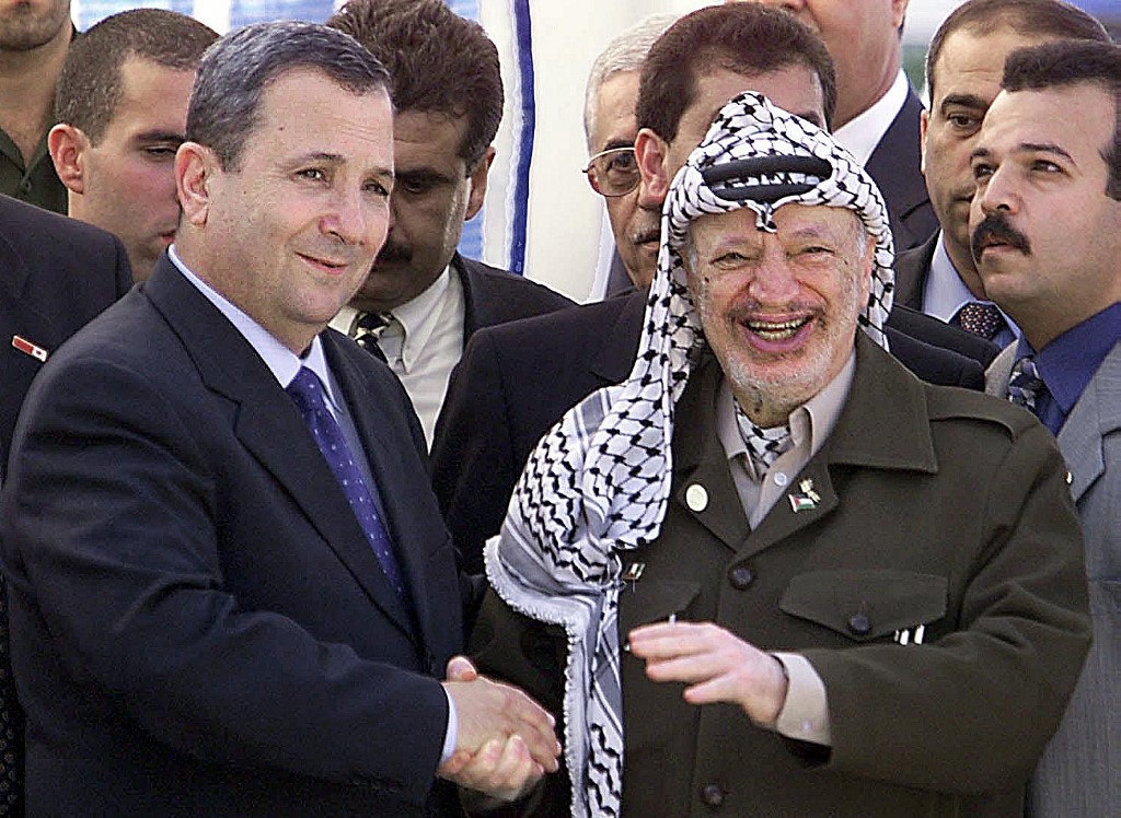 Then-Israeli Prime Minister Ehud Barak and then-Palestinian leader Yasser Arafat meet in 1999 (AFP)