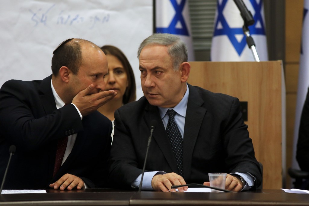 Yamina leader Naftali Bennett speaks to Netanyahu in Jerusalem on 4 March (AFP)