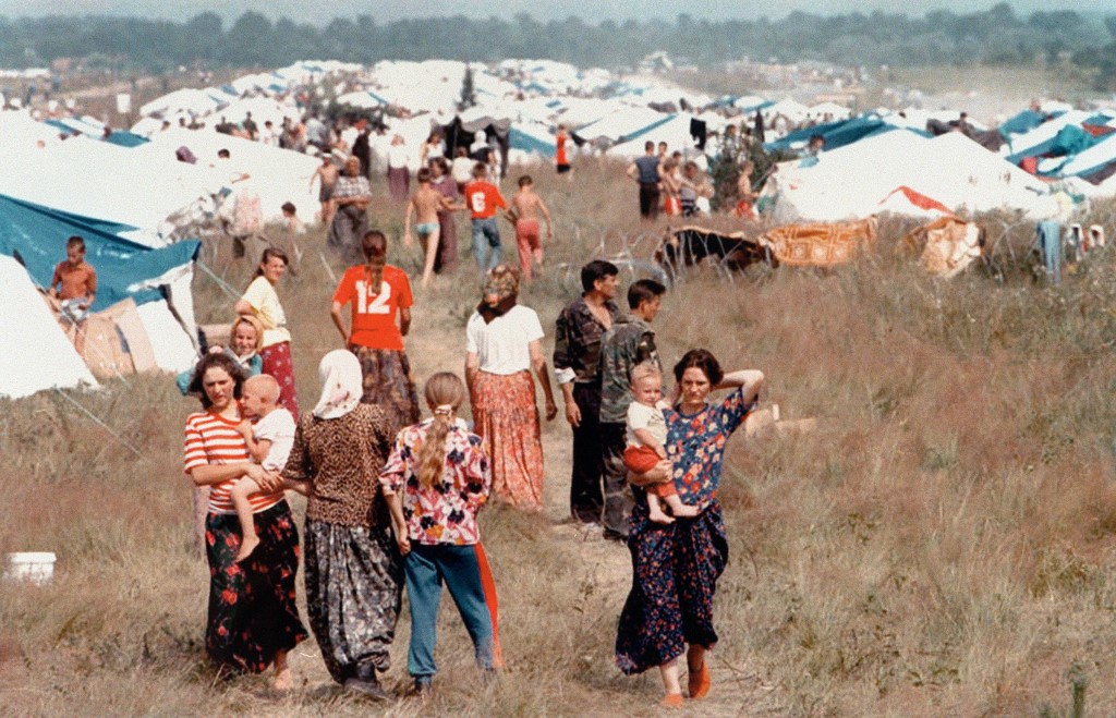 Bosnian refugees are pictured at a UN camp in Tuzla in 1995 (AFP)