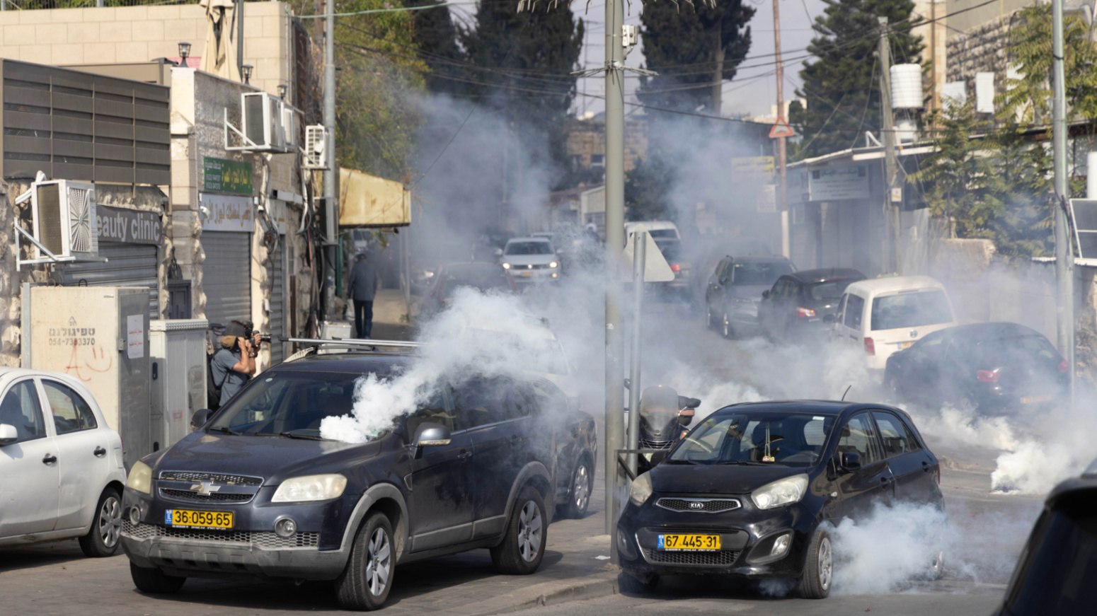 Cars surrounded by tear gas in Jerusalem.