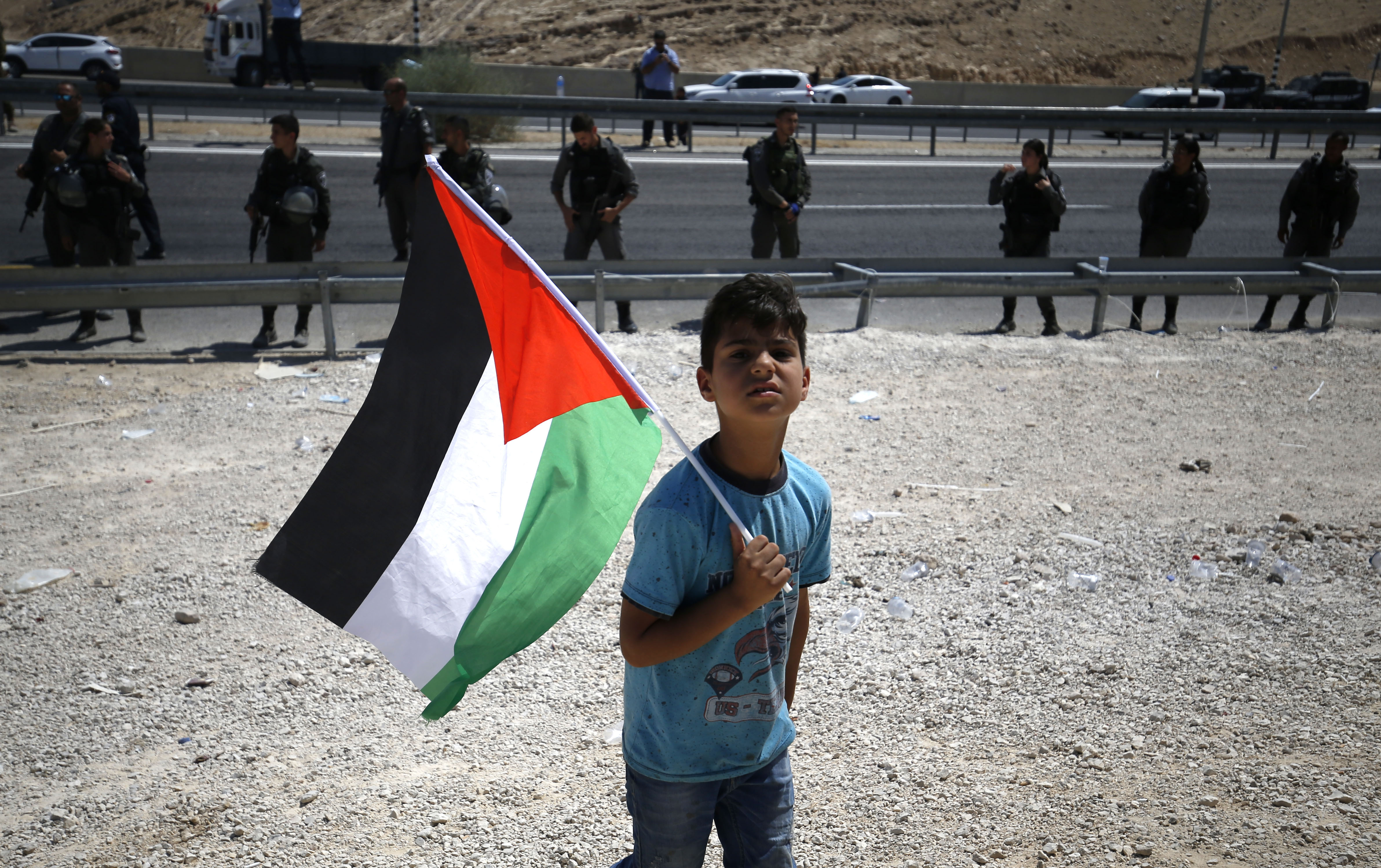 A child protests against the planned demolition of the Palestinian village of Khan al-Ahmar (AFP)