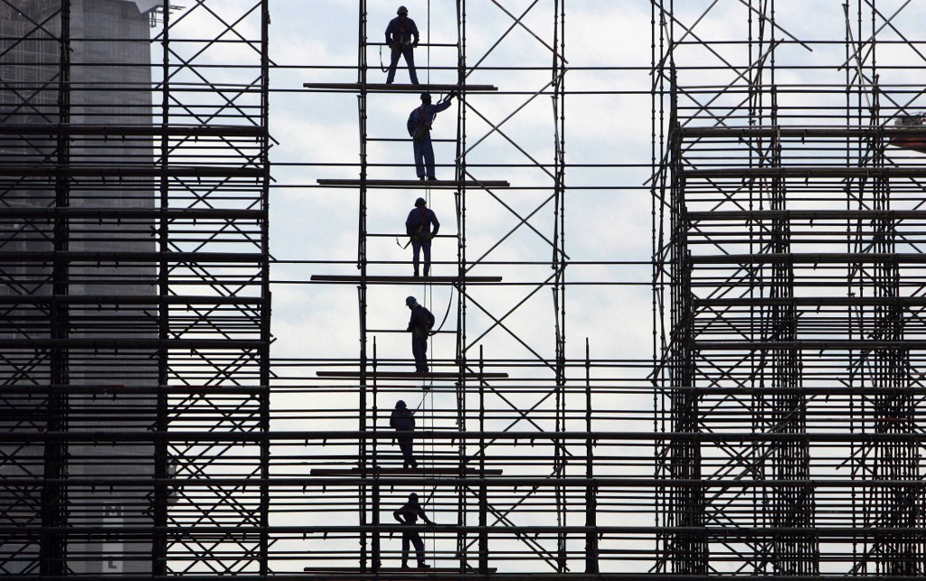 Labourers work at a construction site in Dubai in 2007 (AFP)
