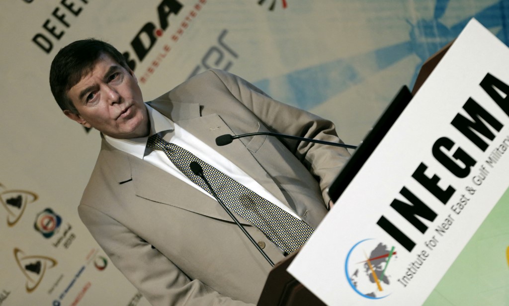 Philip Dunne, then Britain’s defence procurement minister, is pictured in Abu Dhabi in 2013 (AFP)