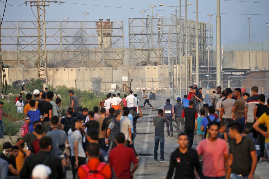 Palestinians demonstrate at Gaza’s Erez crossing on 3 October (AFP)