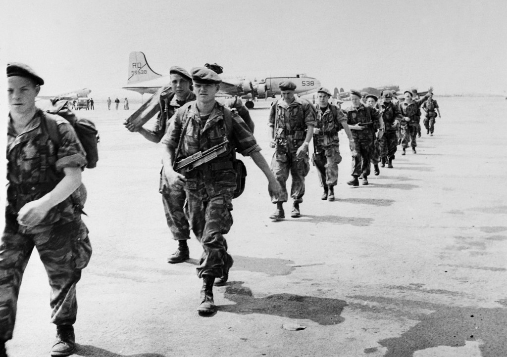 French paratroopers board a transport plane near Algiers in 1956 (AFP)