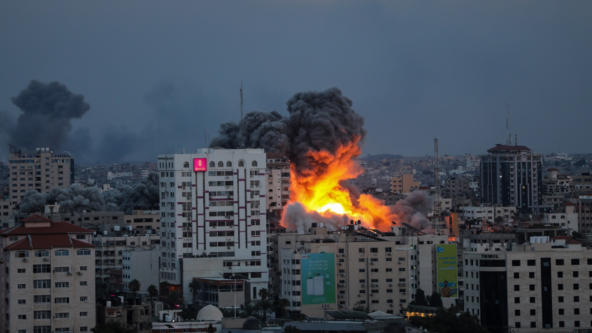 Israeli air strikes hit a building in the Gaza Strip on 7 October (MEE/Mohammed Hajjar)