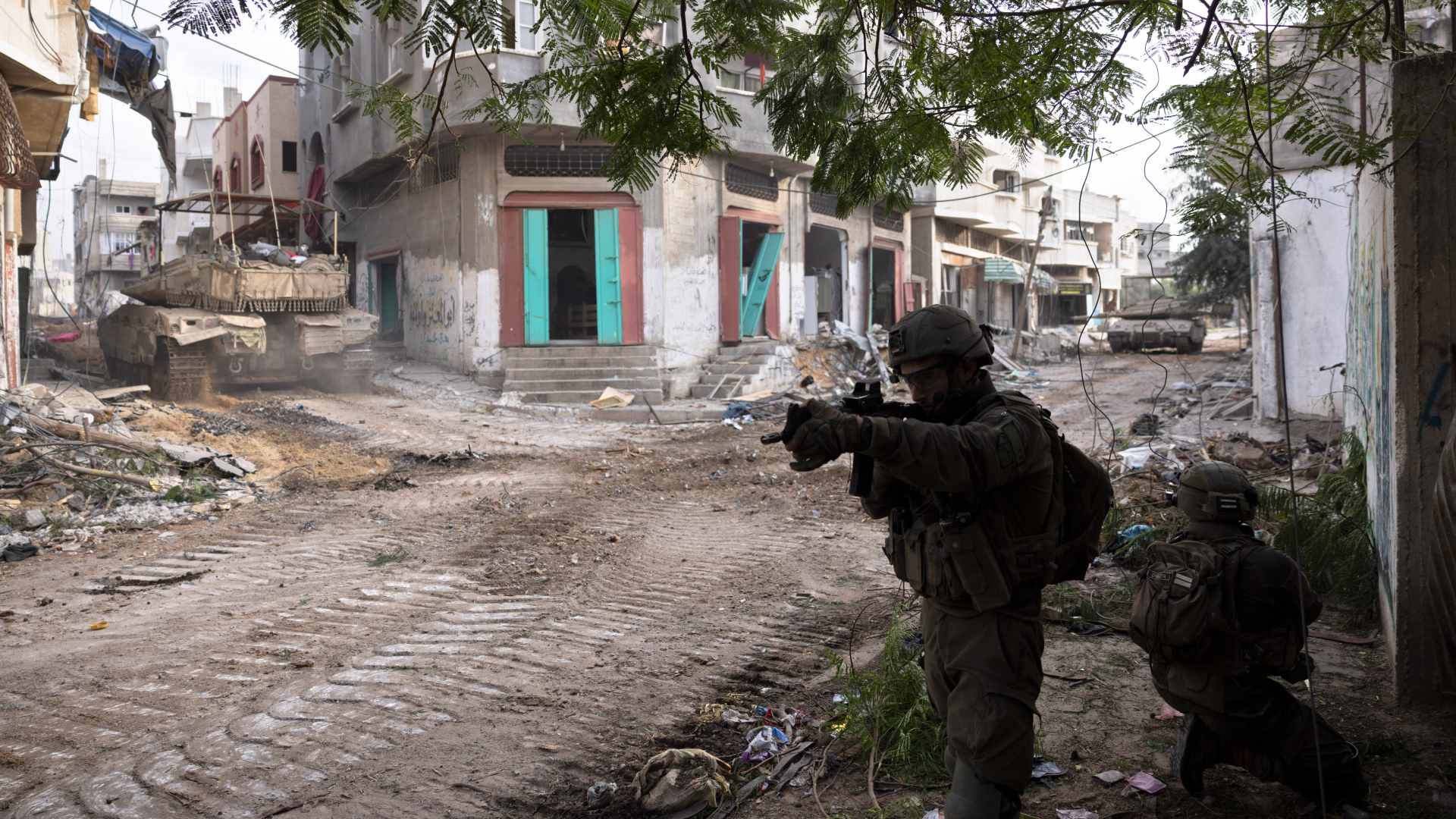 Israeli soldiers in Gaza City's Shijaiyah neighbourhood on 8 December 2023 (AP)