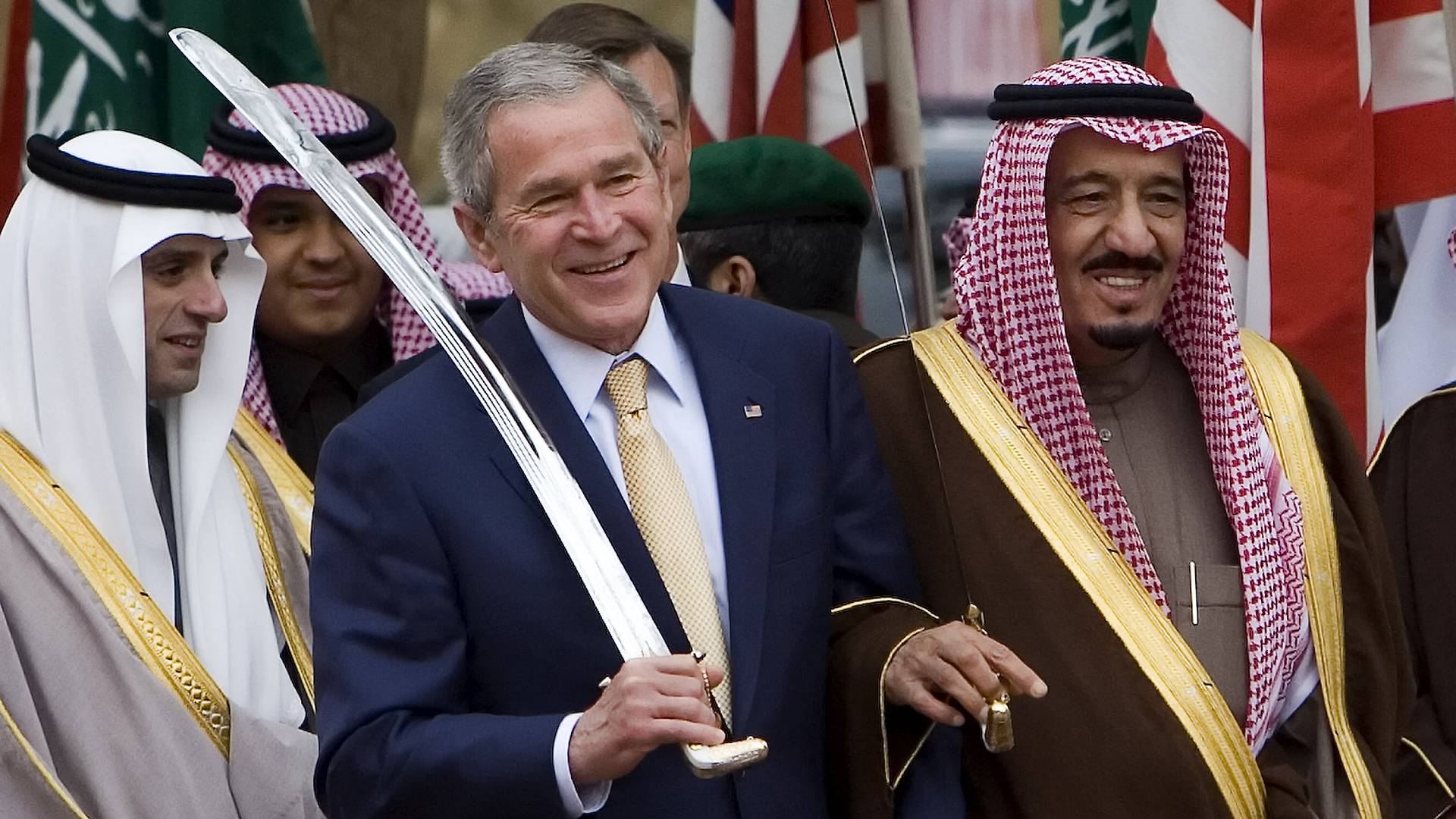 US President George W Bush dances with a sword with Salman bin Abdulaziz, then the governor of Riyadh, on 15 January 2008