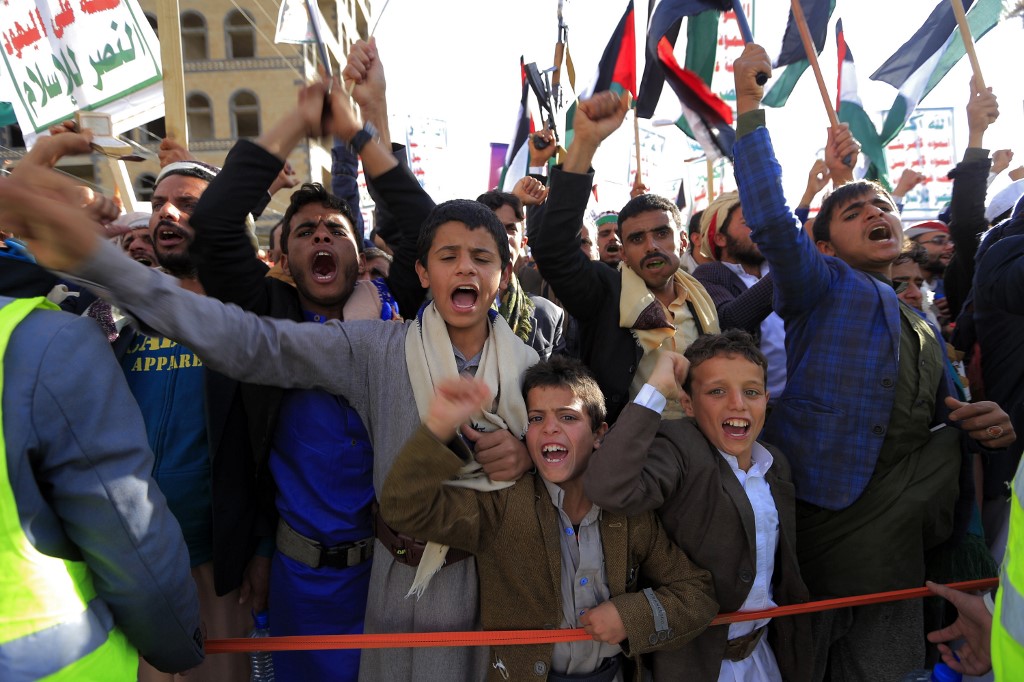 Young Yemeni supporters of the Huthi rebels chant slogans and wave Palestinian flags as they attend a pro-Palestinian rally in the rebel-held capital Sanaa on January 31, 2020,