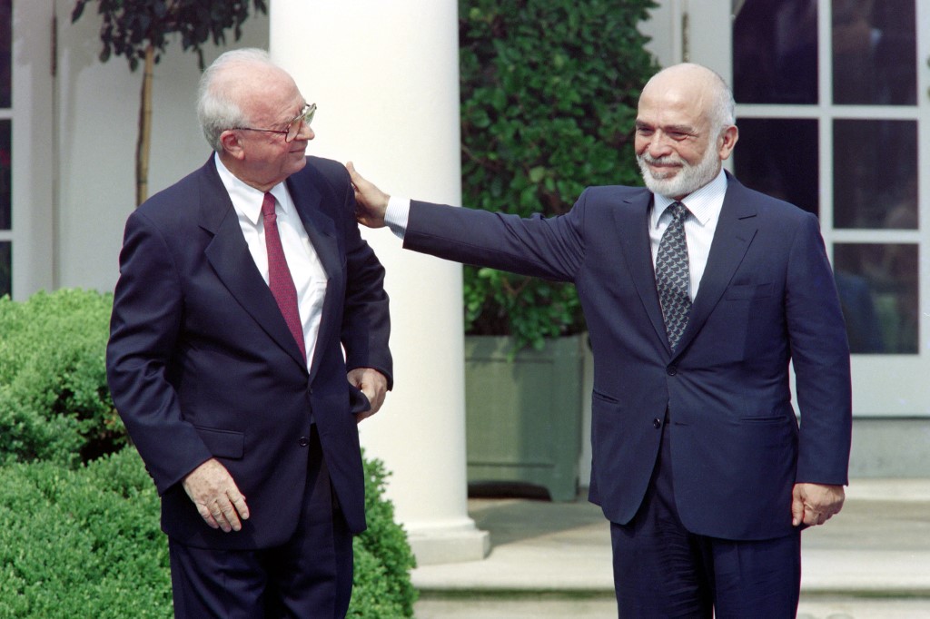 Hussein stands with former Israeli Prime Minister Yitzhak Rabin in Washington in 1994 (AFP)