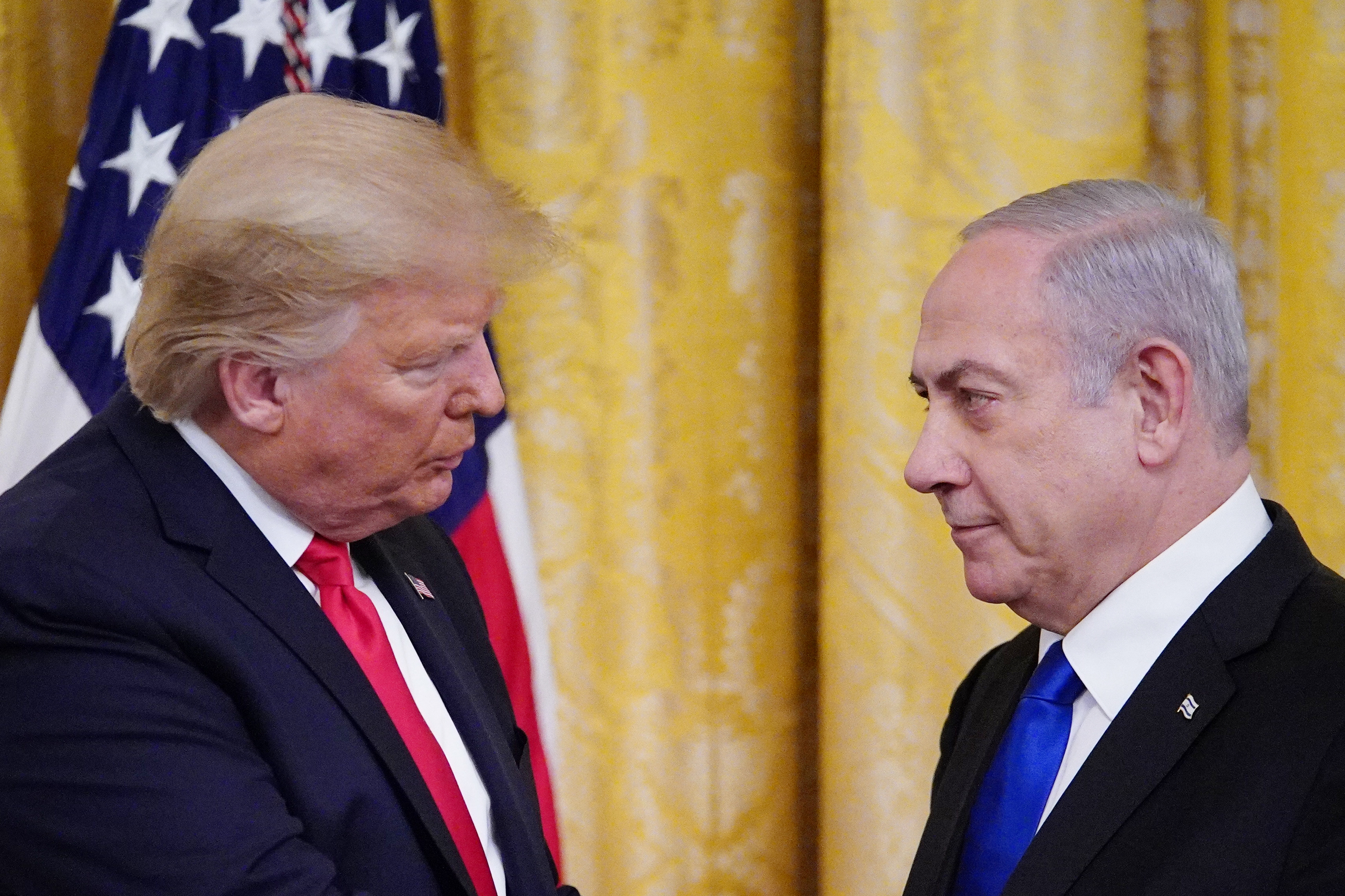 US President Donald Trump and Israel's Prime Minister Benjamin Netanyahu in the East Room of the White House in Washington, DC on 28 January (AFP)