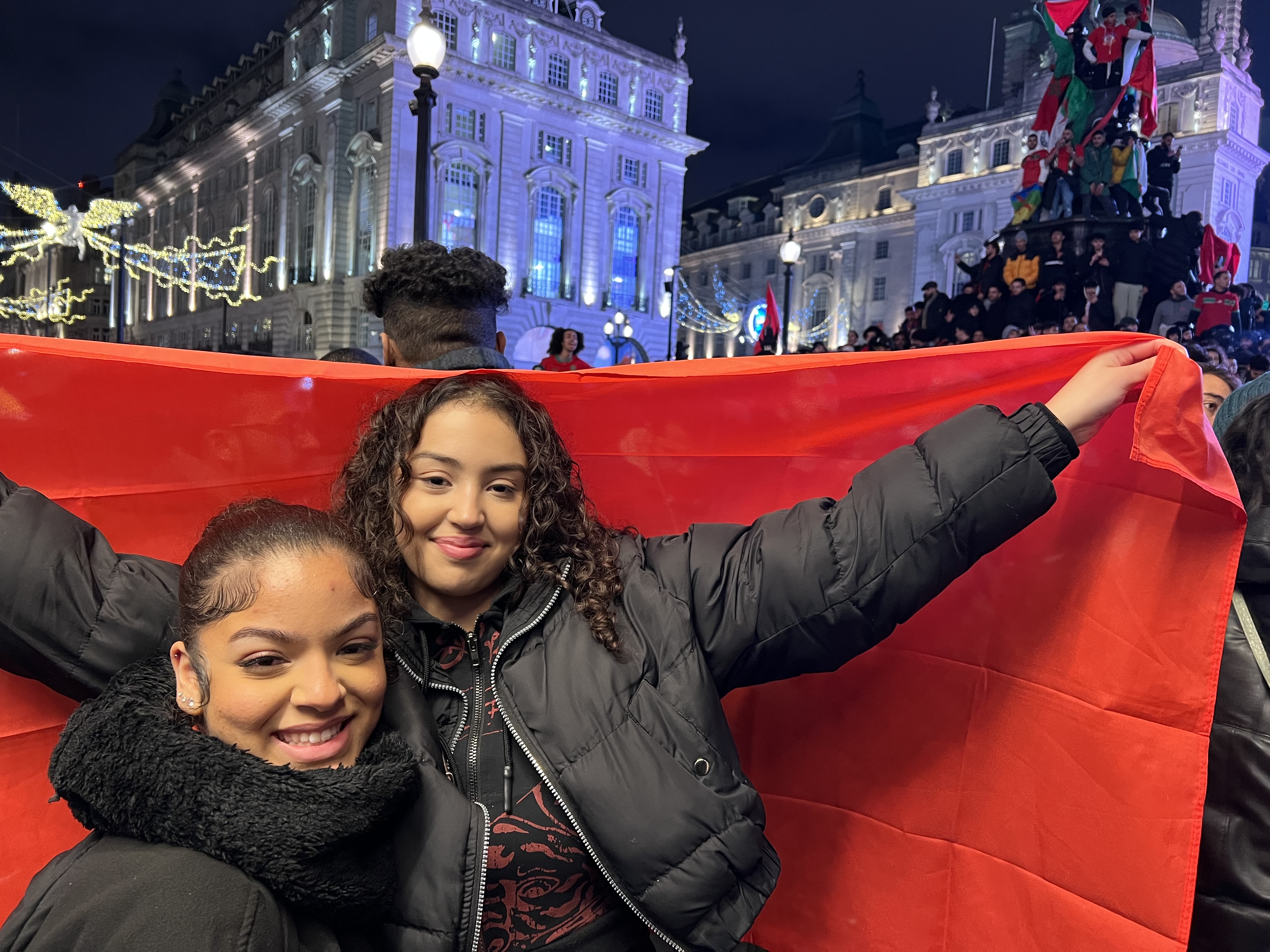 Imane Ali and her sister Franscesca came to celebrate with her fellow Moroccans in Piccadily Circus (MEE/Areeb Ullah)