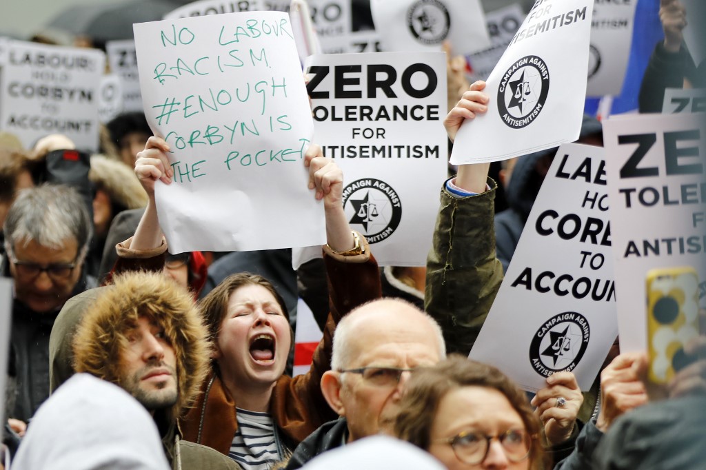 People participate in a protest organised by the Campaign Against Antisemitism outside Labour offices in London in 2018 (AFP/File photo)