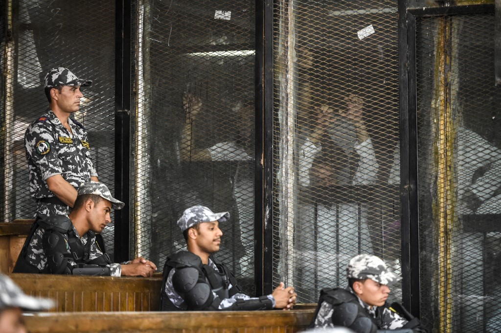 Members of Egypt’s Muslim Brotherhood are seen during their 2018 trial in Cairo (AFP)