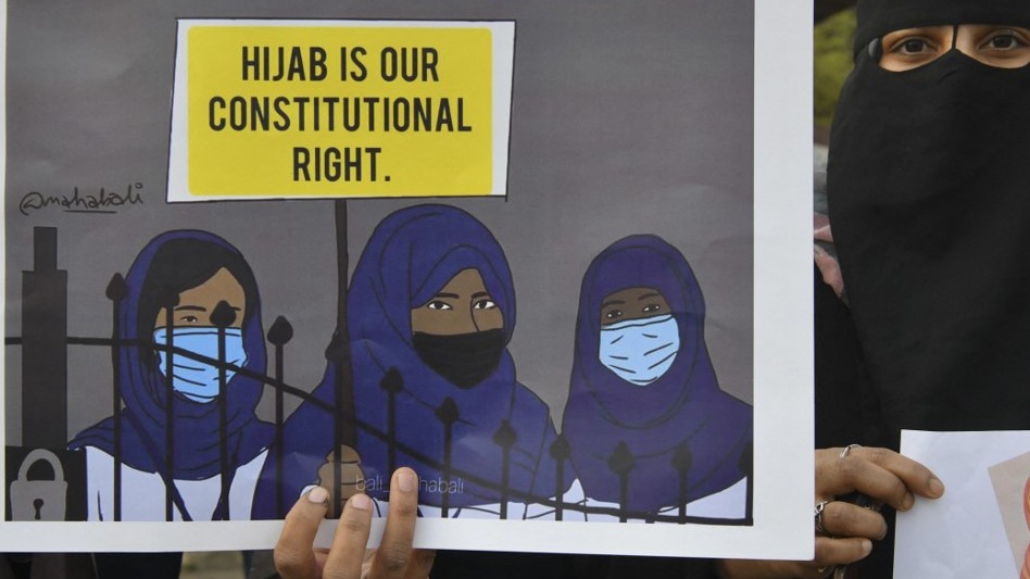 Muslim women attend a protest after educational institutes in Karnataka, India, denied entry to students for wearing hijabs, in Bangalore on 7 February 2022 (AFP)