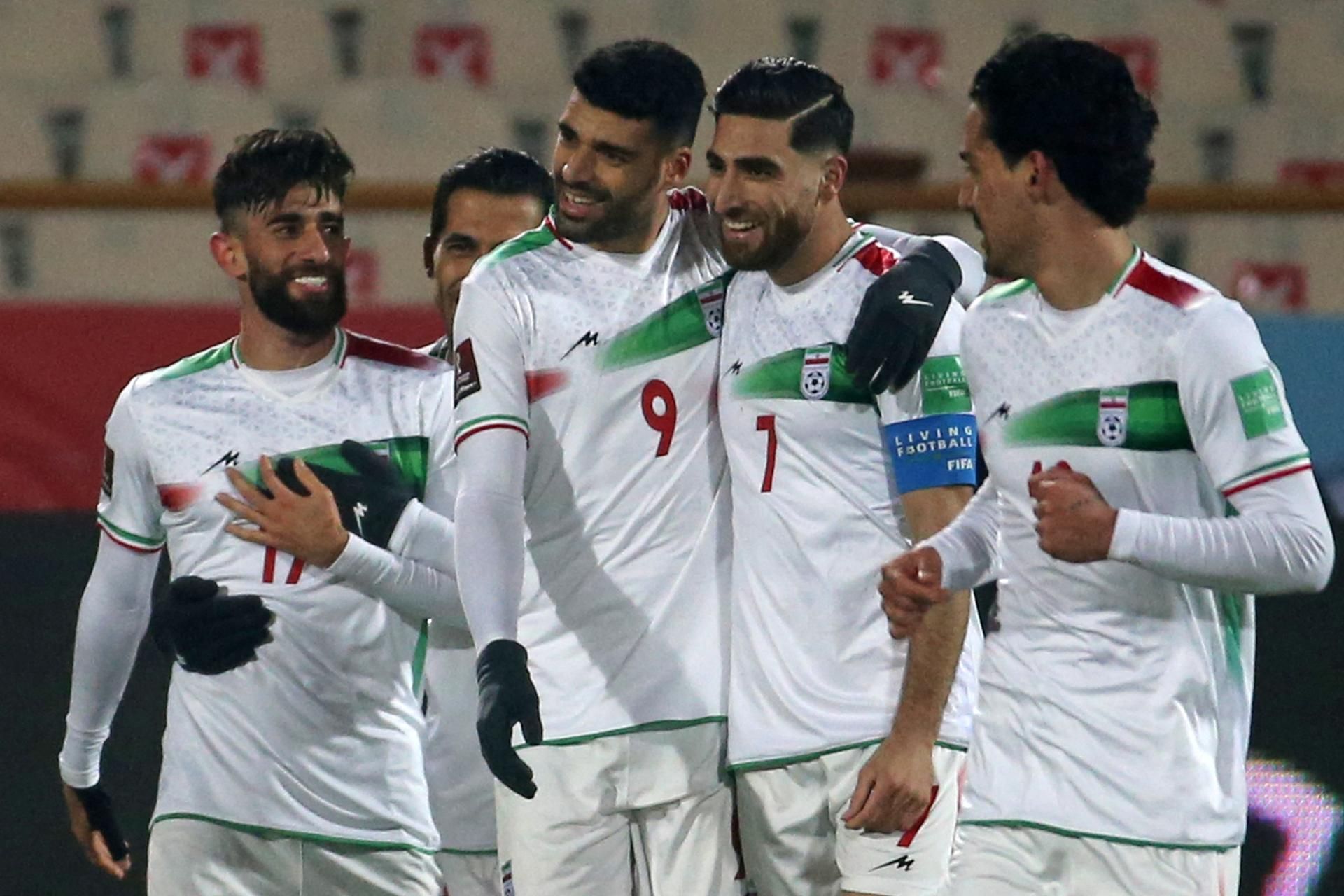 Iran's Mehdi Taremi (second left) celebrates with teammates after scoring against the UAE in World Cup qualifying in Tehran in February 2022 (AFP)