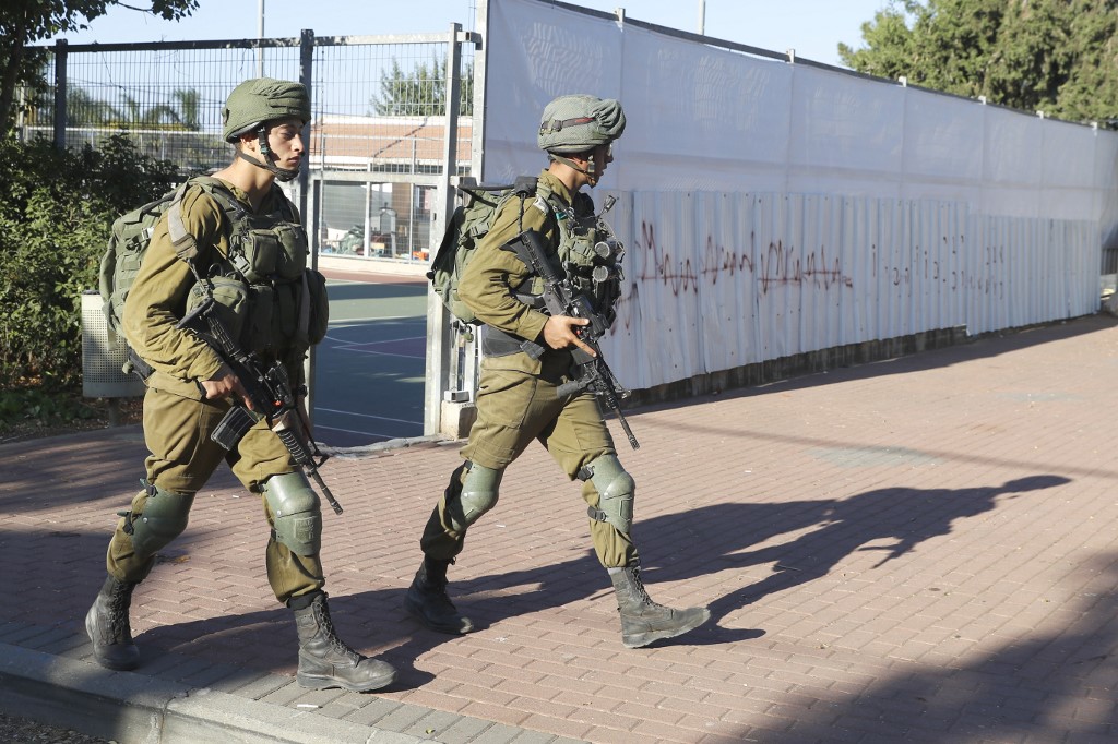 Israeli soldiers patrol in the northern Israel-Lebanon border area on 2 September (AFP)