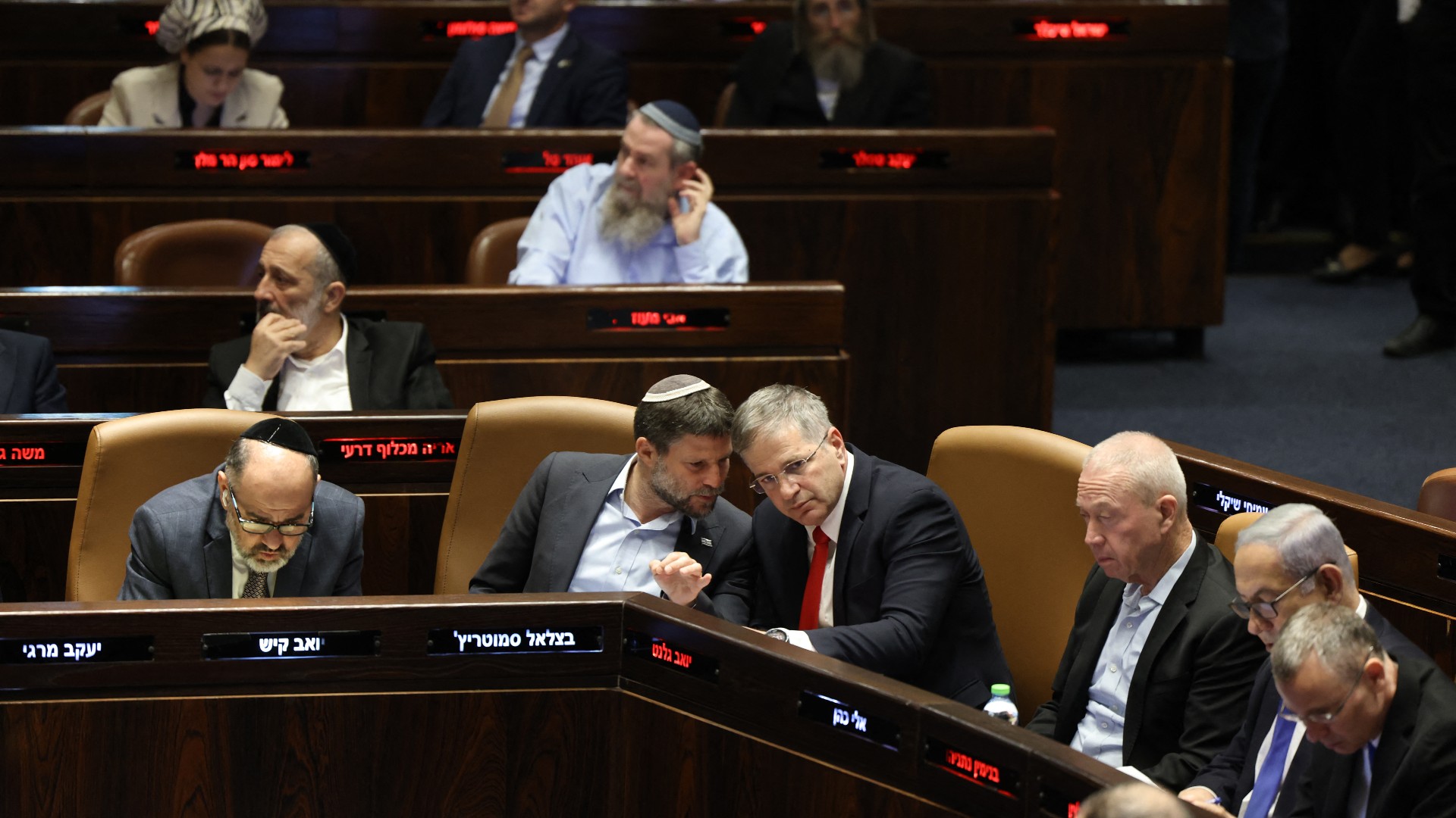 Parliamentarians attend a session at the Knesset, Israel's parliament, in Jerusalem on 24 July 2023 (AFP)