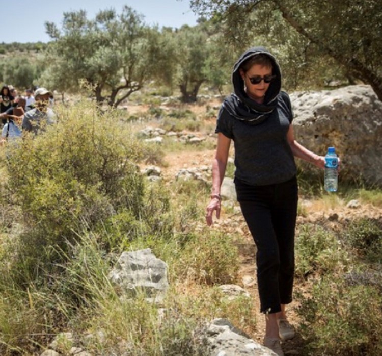 "On a walk through occupied Ramallah... one of the writers turned to me and said, "there is little we can do, but you can publish." (Photo of Alexandra Pringle in Ramallah in 2017/supplied)