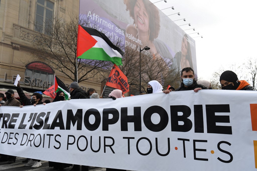 Protesters demonstrate against Islamophobia in Paris on 21 March 2021 (AFP)