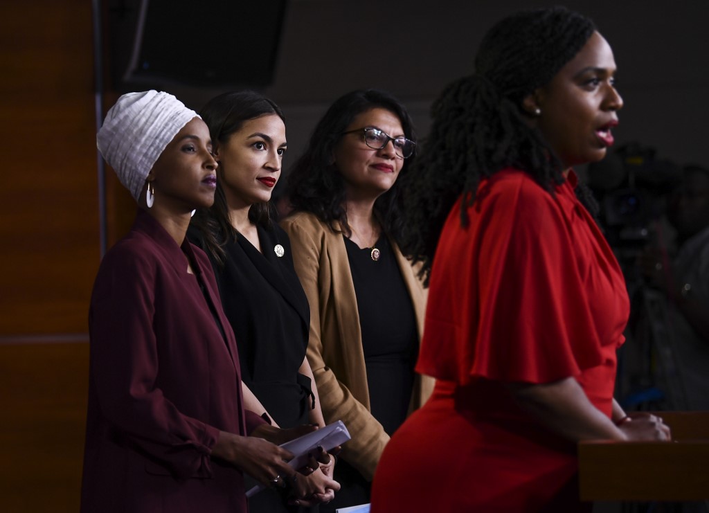 US representatives Ilhan Omar, Alexandria Ocasio-Cortez, Rashida Tlaib and Ayanna Pressley hold a news conference in Washington on 15 July (AFP)