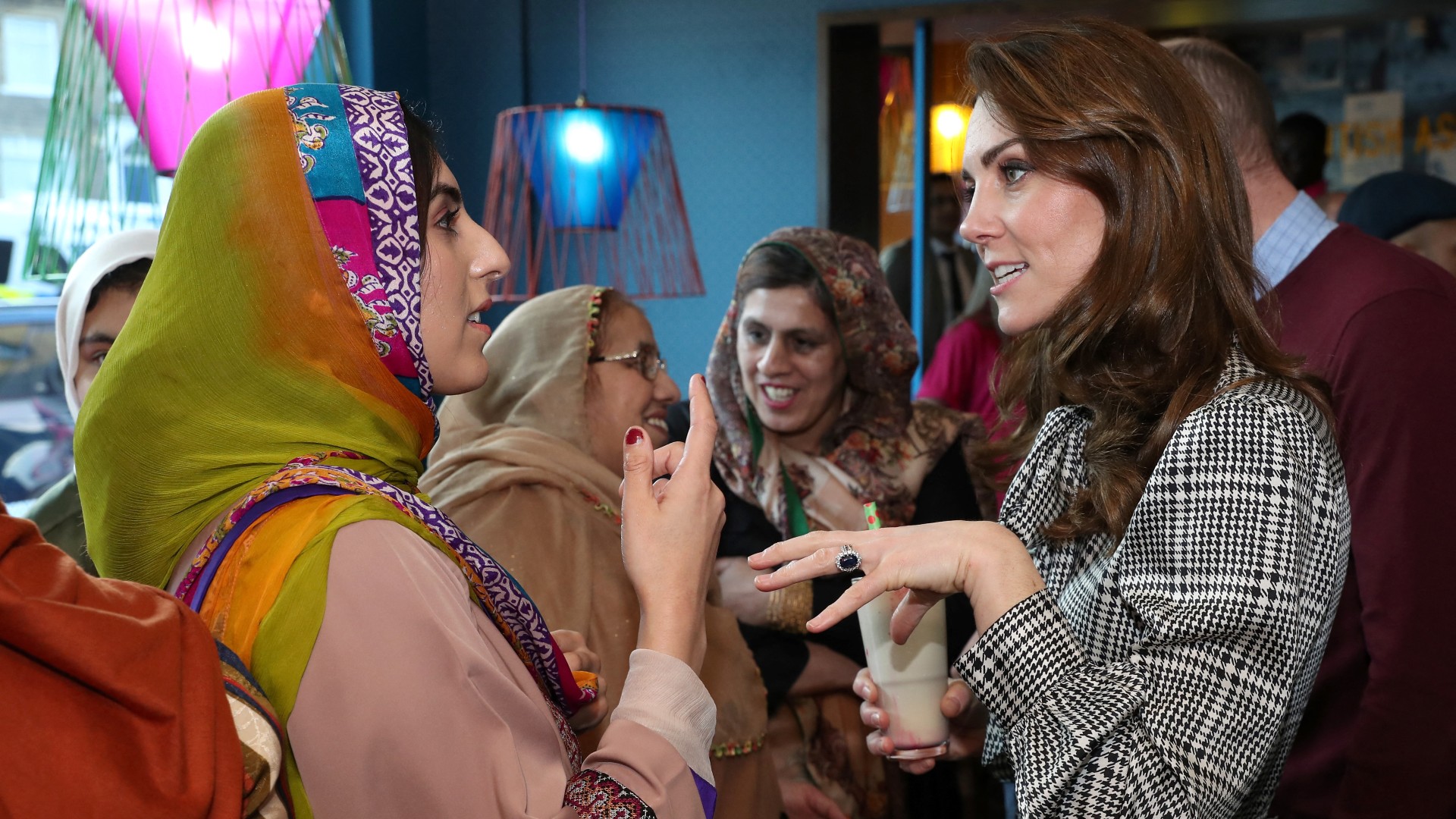 Britain's Catherine, Duchess of Cambridge reacts as she meets representatives from the UK Womens Muslim Council and women whose lives have benefitted from the Councils Curry Circle in Bradford on 15 January, 2020 (AFP)