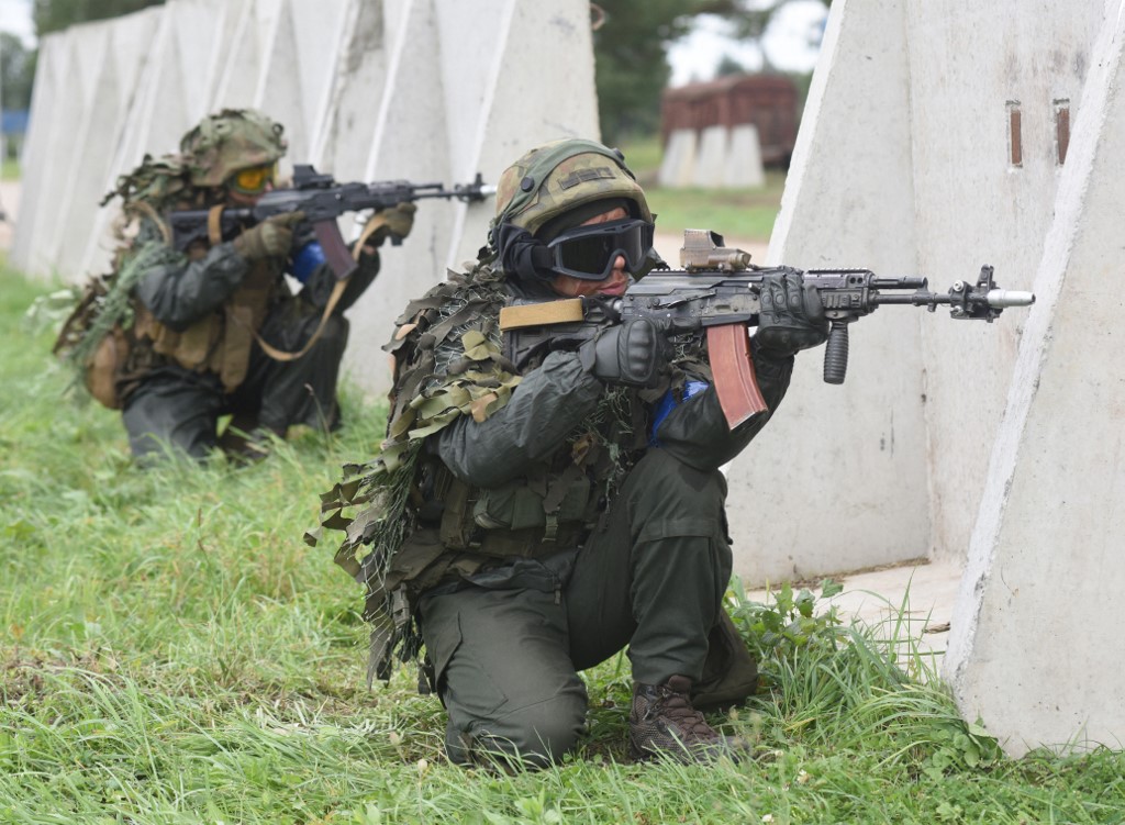 Ukrainian servicemen take part in the joint Rapid Trident military exercises with the US and other Nato countries not far from Lviv on 24 September 2021 (AFP)