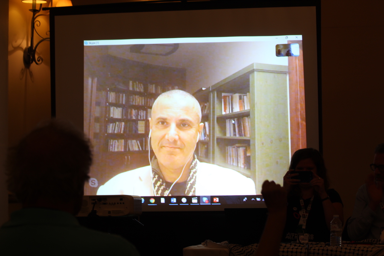 Omar Barghouti speaks at the Labour Party conference via Skype (Alex MacDonald)
