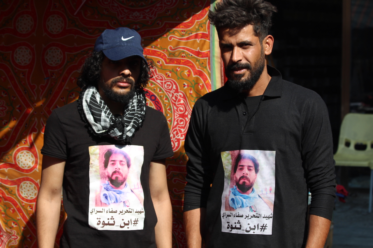 Protesters wear T-shirts depictng Saraa al-Sarray (Alex MacDonald)