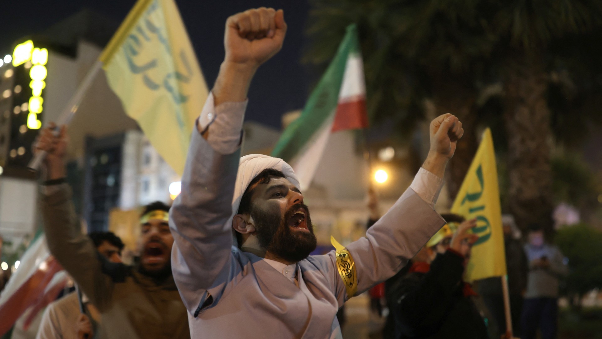 Iranians celebrate on a street, after the IRGC attack on Israel, in Tehran, 14 April (Reuters/Majid Asgaripour/WANA)